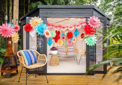 Vibrant And Eclectic Paper Decorations For Summer Celebrations In A Garden Room decor with streamers