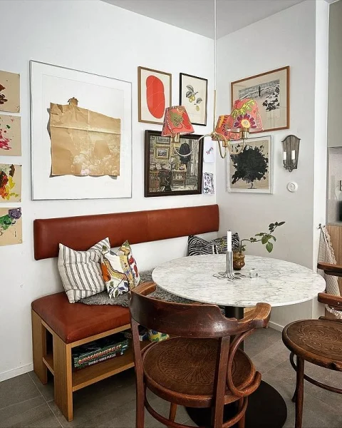 Cozy And Serene Hygge-Inspired Breakfast Nook With Mid-Century Modern Furniture And Art Wall hygge decor