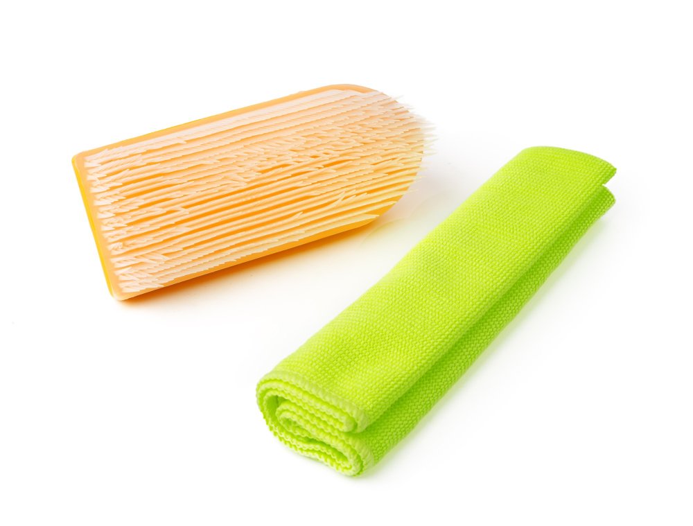 brush and microfiber cloth cleaning chalk wall