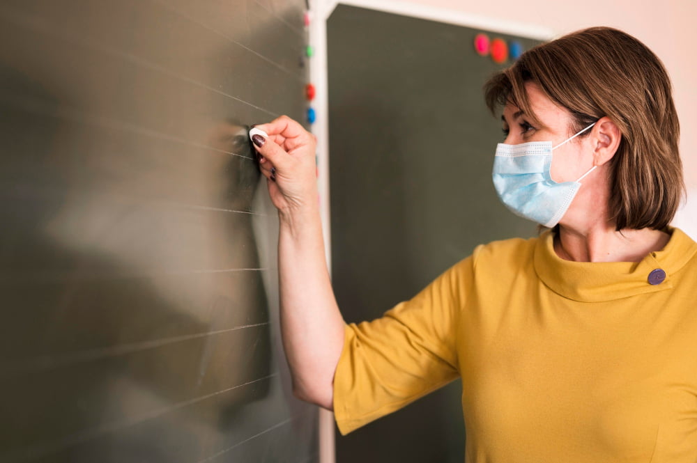 mask writing at chalkboard