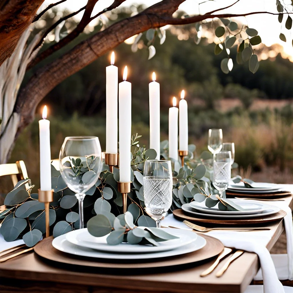 eucalyptus branches and white candle setup